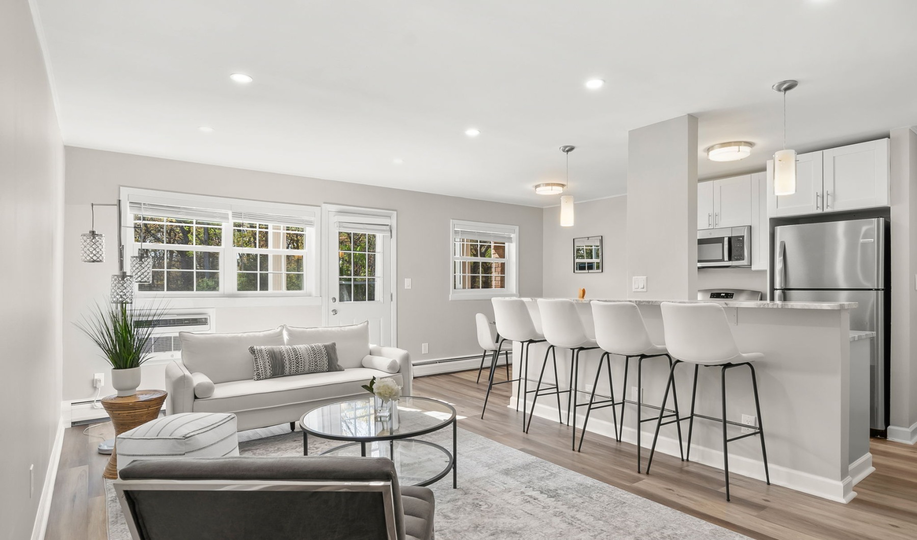 kitchen with ample counter-space, modern appliances and bright lighting